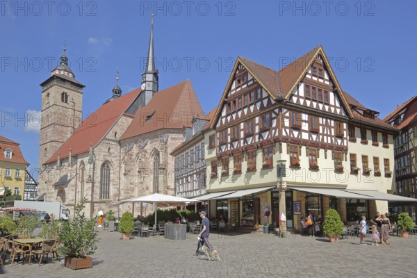 Late Gothic St George's Church and half-timbered houses with pedestrians, Altmarkt, Schmalkalden, Franconia, Thuringia, Germany