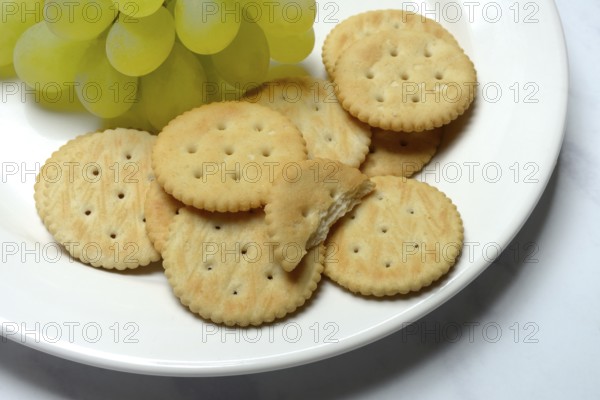 Crackers, crackers with grapes on a plate