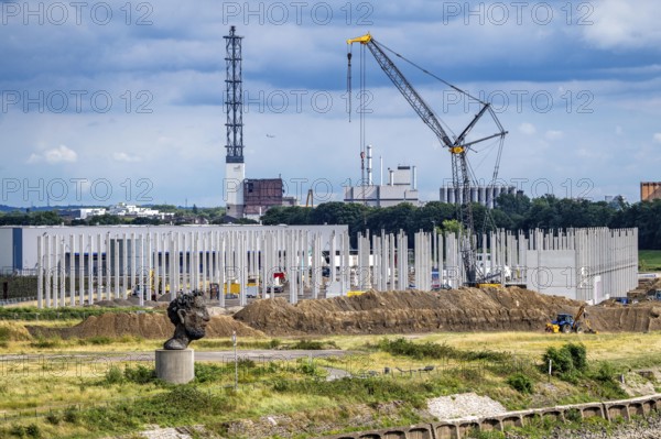 Construction of a new logistics hall on the Mercatroinsel, Hall 2, next to an existing hall, approx. 25, 000 square metres in size, in Duisburg-Ruhrort, shell construction, sculpture The Echo of Poseidon on the Rhine, North Rhine-Westphalia, Germany