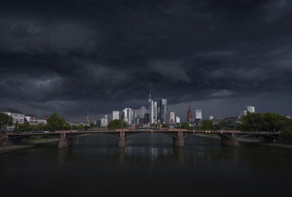 A storm passes over the Frankfurt banking skyline with gloomy clouds, Frankfurt am Main, Hesse, Germany