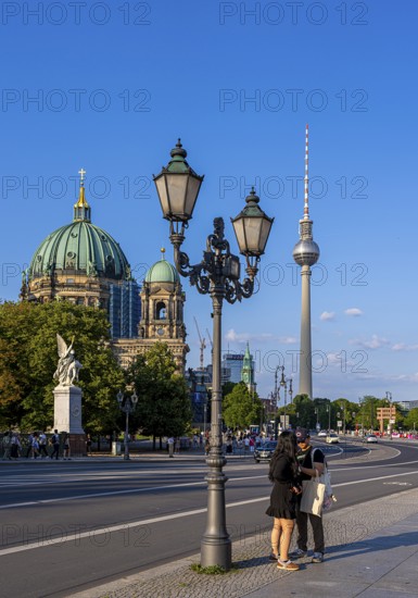 Road traffic and pedestrians on the carriageway in Berlin-Mitte, Unter den Linden, Berlin, Germany