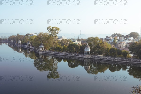 Pagodas in the Swaroop Sagar Garden on Lake Pichola in the morning light, Udaipur, Rajasthan, India