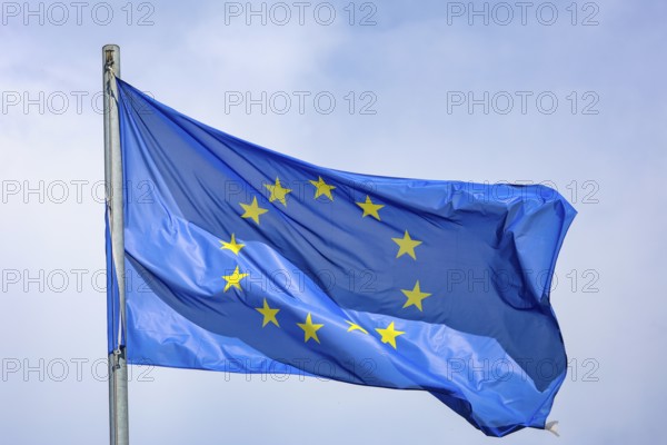 Düsseldorf, North Rhine-Westphalia, Germany - European flag fluttering in the wind on the flagpole, symbolic image of EUROPA