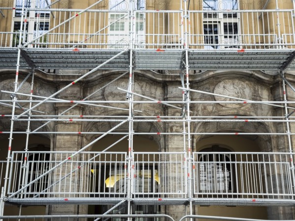 Scaffolded façade of the district court with metal platforms and stairs in Wuppertal, Germany