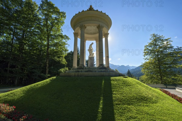 Statue of Venus with Cupid in the Temple of Venus above the terraced gardens, backlight, long shadows, blue sky, park of Linderhof Castle, UNESCO World Heritage Site, Ettal, Unterammergau, Garmisch-Partenkirchen, Upper Bavaria, Bavaria, Germany