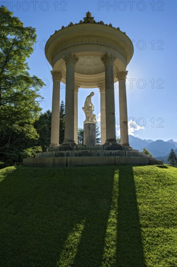 Statue of Venus with Cupid in the Temple of Venus above the terraced gardens, backlight, long shadows, blue sky, park of Linderhof Castle, UNESCO World Heritage Site, Ettal, Unterammergau, Garmisch-Partenkirchen, Upper Bavaria, Bavaria, Germany