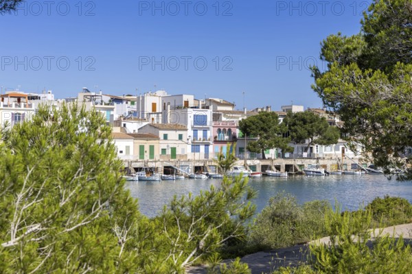 Portocolom fishing village on Majorca with boats and colourful houses Holiday by the sea in Portocolom, Spain