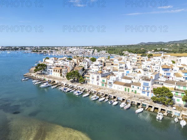 Portocolom fishing village on Majorca aerial view from above with boats holiday by the sea trip in Portocolom, Spain