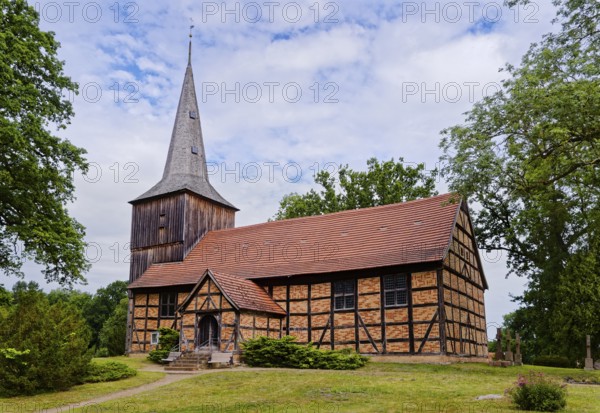 The Evangelical Lutheran St Peter's Church, the village church of Stuer in the Mecklenburg Lake District, is a half-timbered church with a half-timbered tower that is boarded up above the gabled roof of the nave. Stuer, Mecklenburg-Western Pomerania, Germany