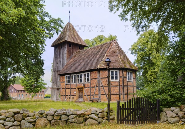 The village church of Karrenzin is a half-timbered church dating from 1721. The boarded tower on the west gable carries the bells. Karrenzin, Ludwigslust-Parchim, Mecklenburg-Voprpommern, Germany
