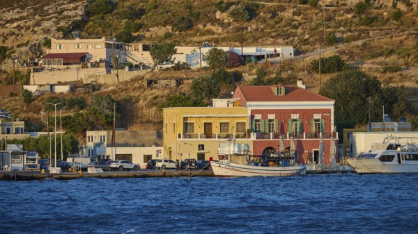 Harbour town with colourful buildings on the waterfront and hills in the background at sunset, Agia Marina, Leros, Dodecanese, Greek Islands, Greece