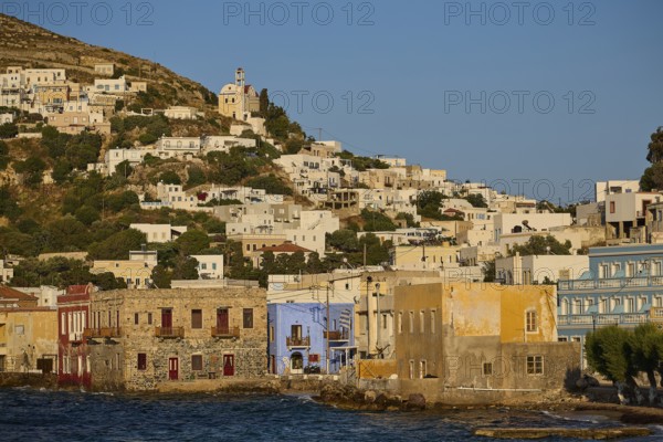 Coastal town with colourful houses along the water, church on the hill above the town, Agia Marina, Leros, Dodecanese, Greek Islands, Greece