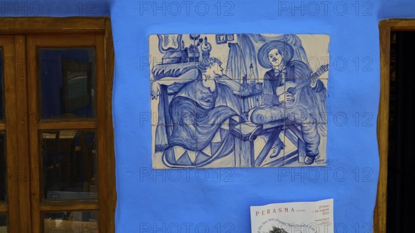 Restaurant Mylos, Blue wall tiles with a musician and a woman in a living room, Agia Marina, Leros, Dodecanese, Greek Islands, Greece