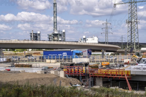 Motorway construction site at the Leverkusen-West junction, A1 and A59 motorways, new construction, reconstruction of the motorway junction due to the construction of the new Leverkusen Rhine bridge, construction period until the end of 2027, in the background, the Bürrig waste incineration plant, Leverkusen waste disposal centre, North Rhine-Westphalia, Germany