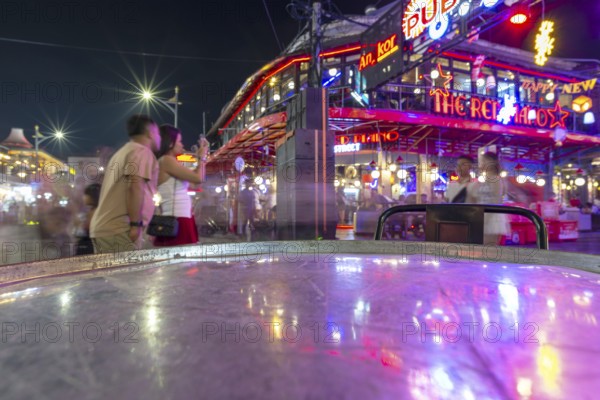 Neon lights, the legendary restaurant THE RED PIANO, Pub Street in the evening, entertainment district with bars and restaurants, Siem Reap, Cambodia