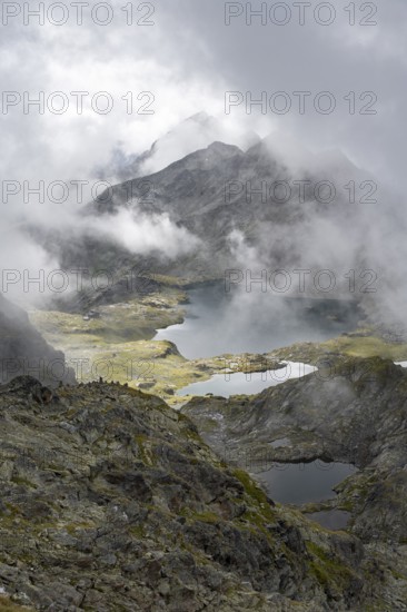 Mountain lakes Wangenitzsee and Kreuzsee, cloudy mountain peaks in the morning, Schober group, Hohe Tauern National Park, Carinthia, Austria