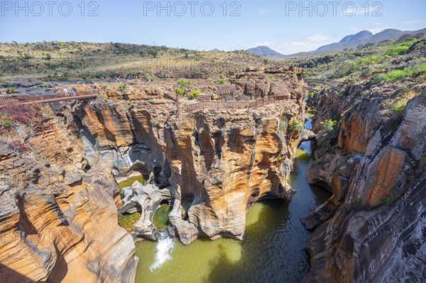 Bridges over a canyon with steep orange-coloured cliffs and the Blyde River, Bourke's Luck Potholes, Panorama Route, Mpumalanga, South Africa