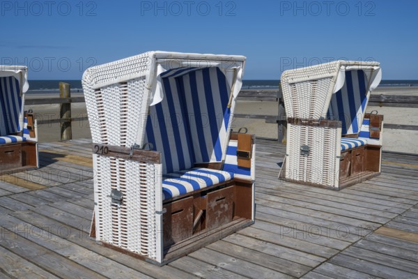 Beach chairs on wooden planks, Sankt Peter Ording, Eiderstedt, North Frisia, North Sea, Schleswig-Holstein, Germany