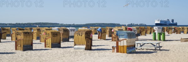 Beach chairs on sandy beach, ferry boat, Laboe, Baltic seaside resort, fjord, Baltic Sea, North Frisia, Schleswig-Holstein, Germany