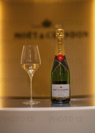 Bottle of Champagne Impérial Brut, filled glass, logo, lettering, headquarters of the champagne brand Moët & Chandon, part of the luxury goods group LVMH Louis Vuitton Moët Hennessy, Avenue de Champagne, Épernay, Marne, France