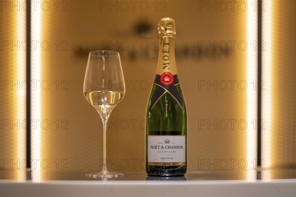 Bottle of Champagne Impérial Brut, filled glass, logo, lettering, headquarters of the champagne brand Moët & Chandon, part of the luxury goods group LVMH Louis Vuitton Moët Hennessy, Avenue de Champagne, Épernay, Marne, France