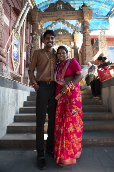 Indian wedding couple, 23 and 25 years old, at Sacchiya Mata Temple, Osian Temple Complex, Jodhpur, Rajasthan, India