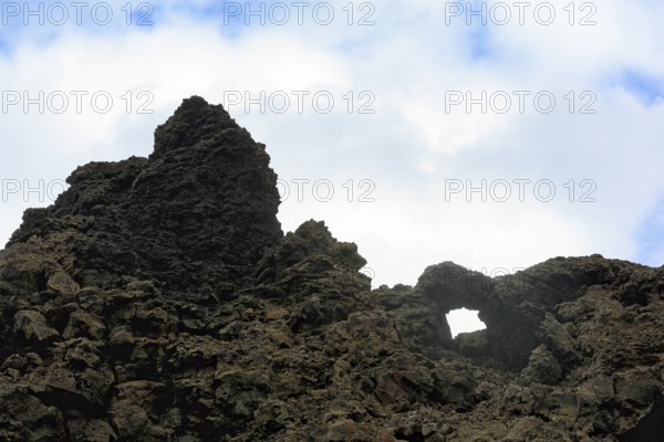 Tuff formation in Dimmuborgir, bizarrely shaped rock formation, rock arch in the lava field, Krafla volcano system, Dimmuborgir National Park, Mývatn, Iceland