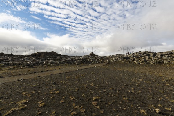 Hiker, hiking trail between Dettifoss and Selfoss, volcanic landscape, Cumulus, North Iceland, Iceland