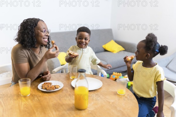 Mother and children enjoying a healthy breakfast together at the dining table, creating a warm and loving family moment