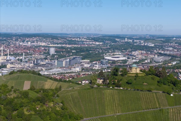 Panoramic picture of a cityscape with a building on a vineyard hill, view of the burial chapel of Stuttgart-Rotenberg, in the background the Mercedes-Benz plant in Stuttgart-Untertürkheim and the MHP Arena, Baden-Württemberg, Germany