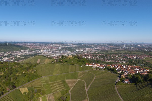 Aerial view of a vineyard with a view of a town and industrial plants in the background, view of Rotenberg near Stuttgart with a burial chapel, in the background the Mercedes-Benz plant in Stuttgart-Untertürkheim and the MHP Arena, Baden-Württemberg, Germany