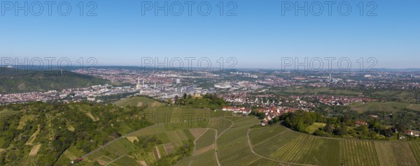 Panoramic view over extensive vineyards with a town and industry in the background, view of Rotenberg near Stuttgart with a burial chapel, in the background the Mercedes -Benz plant in Stuttgart-Untertürkheim and the MHP Arena, Baden-Württemberg, Germany