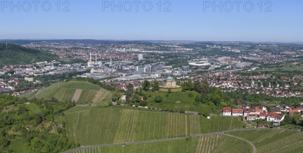 View of a cityscape with vineyards and hills under a blue sky, view of Rotenberg near Stuttgart with burial chapel, in the background the Mercedes-Benz plant in Stuttgart-Untertürkheim and the MHP Arena, Baden-Württemberg, Germany