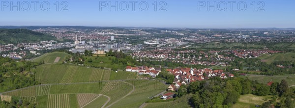 Expansive view of a city and its vineyards under a clear sky, view of Rotenberg near Stuttgart with the burial chapel, in the background the Mercedes-Benz plant in Stuttgart-Untertürkheim and the MHP Arena, Baden-Württemberg, Germany