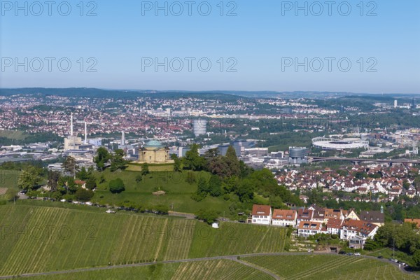 Vineyards and a hilltop building in front of a detailed city panorama, view of Rotenberg near Stuttgart with a burial chapel, in the background the Mercedes-Benz plant in Stuttgart-Untertürkheim and the MHP Arena, Baden-Württemberg, Germany