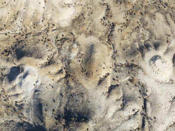 Broken, rocky ground with sparse vegetation. Aerial view. Drone shot. Southern Namibia