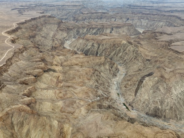 The Fish River Canyon with a length of 160 km is the second largest canyon in the world and the largest in Africa. Aerial view. Drone shot. Ai-Ais Richtersfeld Transfrontier Park, Namibia