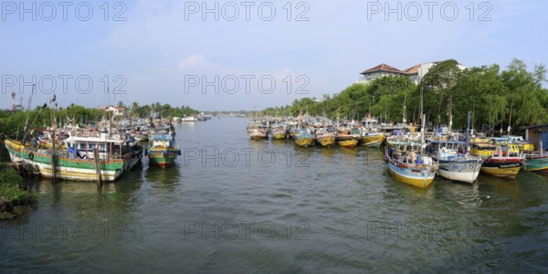 Fishing boats in Negombo river harbor, Sri Lanka