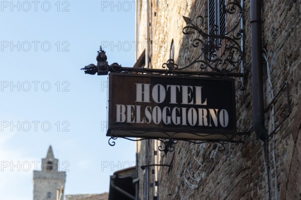 Wrought iron sign of the Hotel Belsoggiorno in San Gimignano, Tuscany, Italy