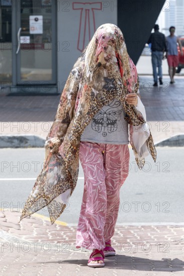 Woman fashionably veiled, Abu Dhabi, United Arab Emirates