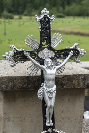 Metal cross with detailed Jesus figure in decorative design, Zgornje Jezersko, Gorenjska, Slovenia