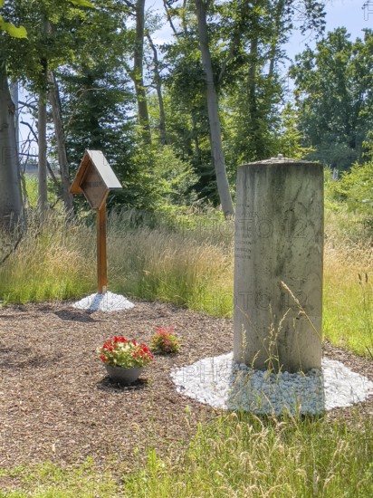 Free-standing stone column on the right Monument with inscription in memory of Bernd Rosemeyer, racing driver killed in an accident at this spot in 1938, wooden memorial plaque in the background on the left Wooden memorial with inscription Memorial to Bernd Rosemeyer 1938, Mörfelden-Walldorf, Hesse, Germany