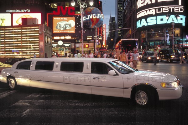 Stretch limousine in Times Square at night, New York City, USA