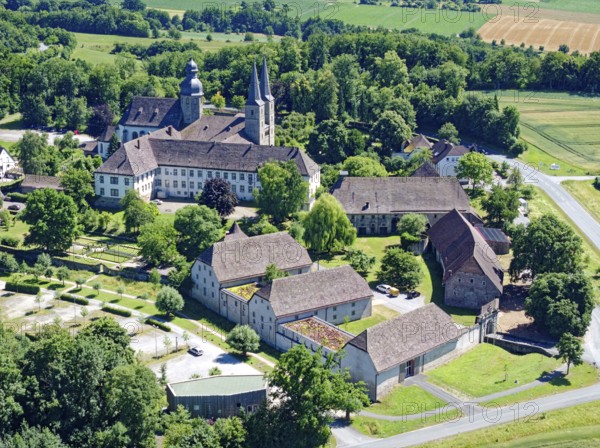 Marienmünster Abbey is a former Benedictine monastery in the North Rhine-Westphalian town of Marienmünster. The monastery was abolished in 1803 and is now a recognised place of pilgrimage. The former abbey church is the parish church of the parish of St James the Elder and is part of the Marienmünster pastoral network in the Höxter deanery of the Archdiocese of Paderborn. Aerial view. Marienmünster, North Rhine-Westphalia, Germany