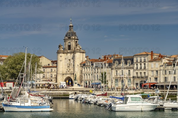 Harbour, Porte de la Grosse Horloge clock tower and the old town in La Rochelle, France