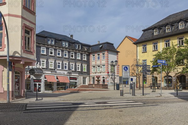 Market street with pharmacy fountain in Ilmenau, Thuringia, Germany