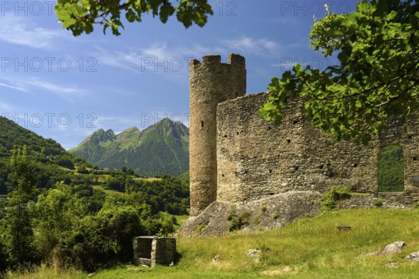 The ruins of the Château Sainte-Marie castle in Esterre and the mountain landscape near Luz-Saint-Sauveur, Pyrenees, France
