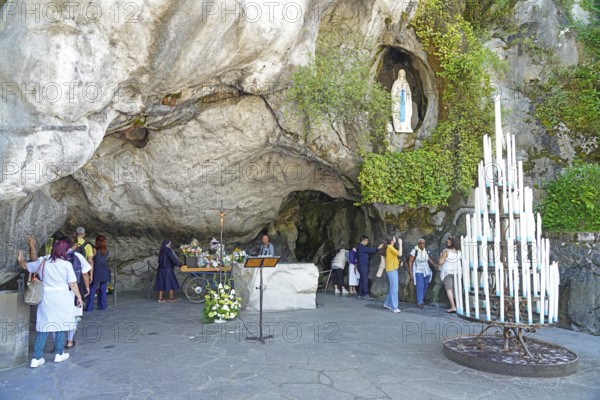 The Grotto of Massabielle in the Holy District in the Marian pilgrimage town of Lourdes, Pyrenees, France