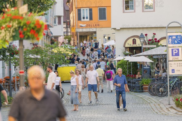 Cosy old town atmosphere with people strolling through a lively alley, 950 years of Weil der Stadt celebration, Böblingen district, Germany