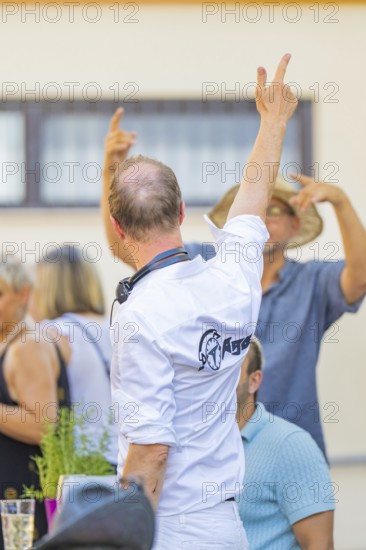 People standing in a relaxed atmosphere at an outdoor summer party, 950th anniversary of Weil der Stadt, Böblingen district, Germany
